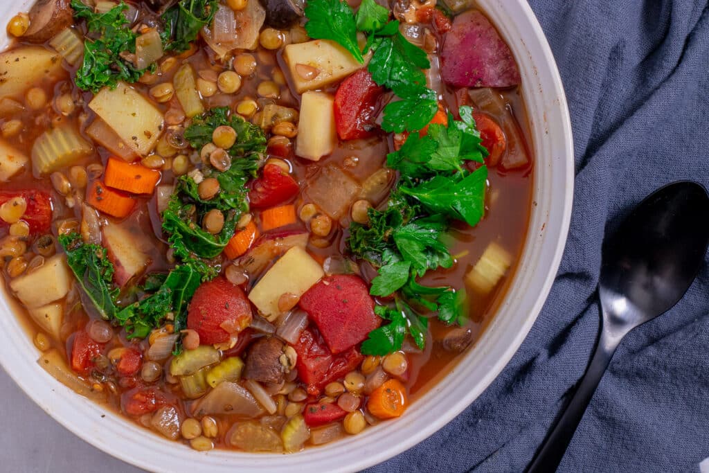 white bowl filled with lentil vegetable stew