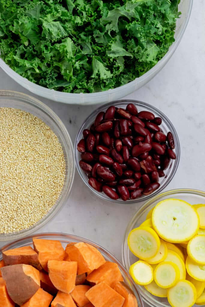 ingredients for vegan buddha bowl on a marble counter