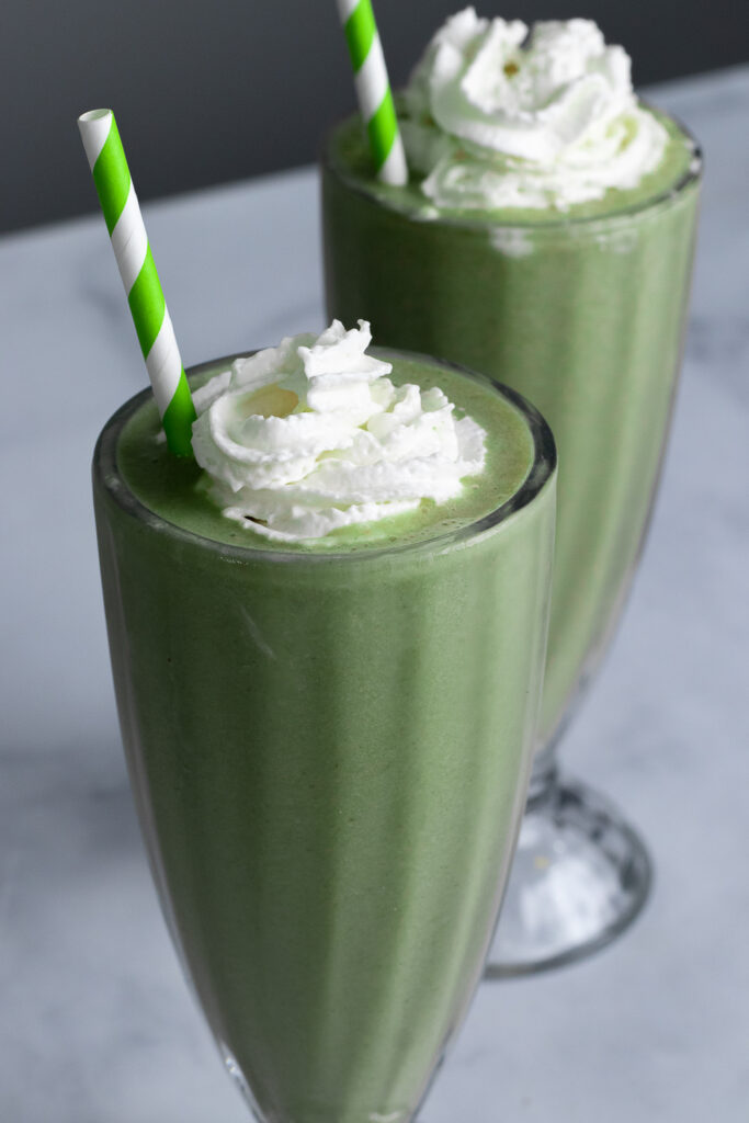 Two shamrock shakes in fountain glasses