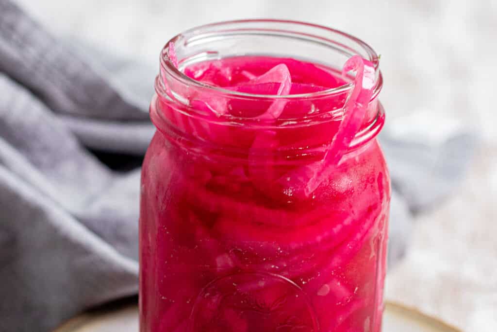 Pickled red onions in a mason jar