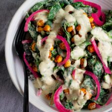 Vegan Kale Caesar Salad with Chickpea Croutons and Pickled Onions