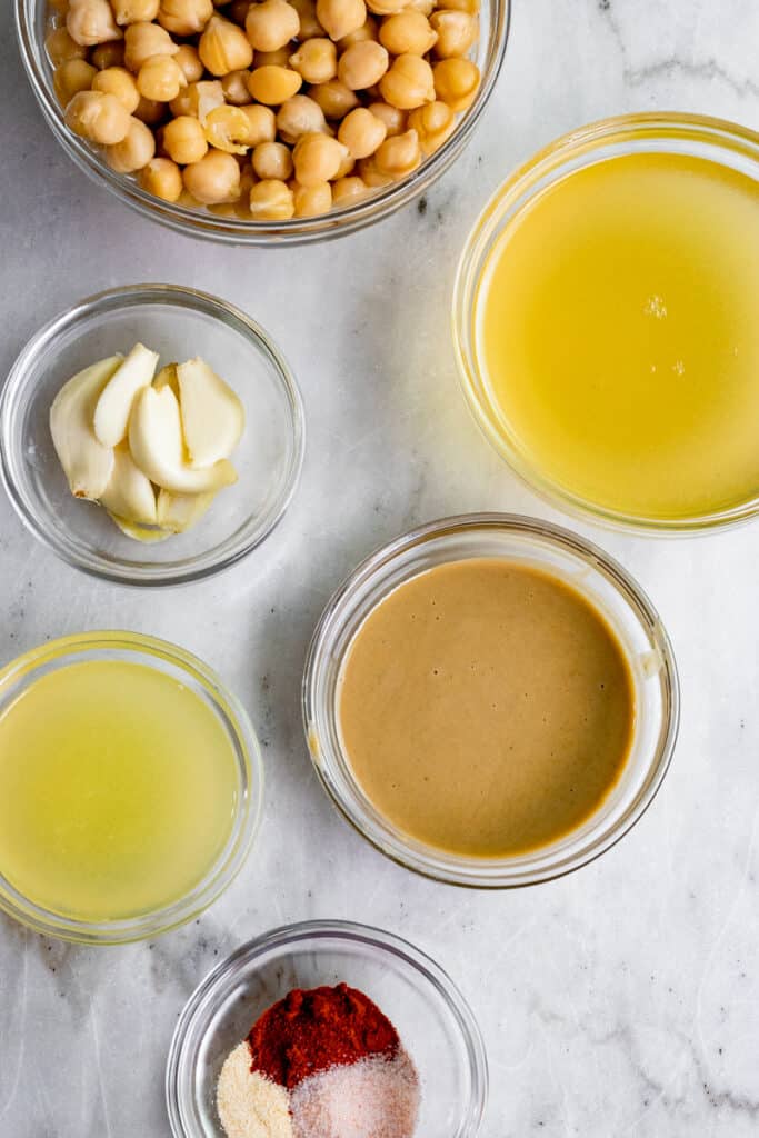 ingredients for hummus in little glass bowls