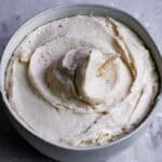 Bowl of vegan buttercream whipped into a spiral