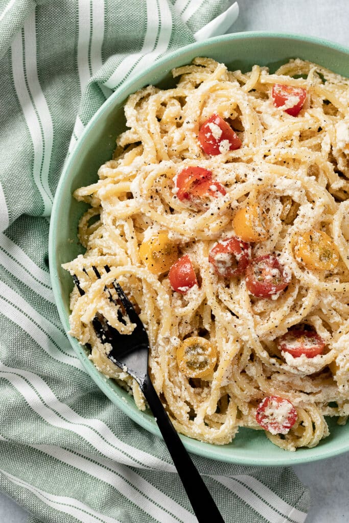 Vegan Ricotta Pasta in a bowl with a napkin