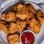 Vegan seitan chicken nuggets on a plate with ketchup