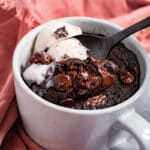 Spoon dipping into mug brownie