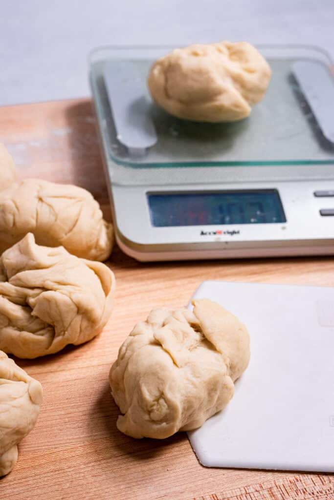 Measuring dough pieces on a food scale