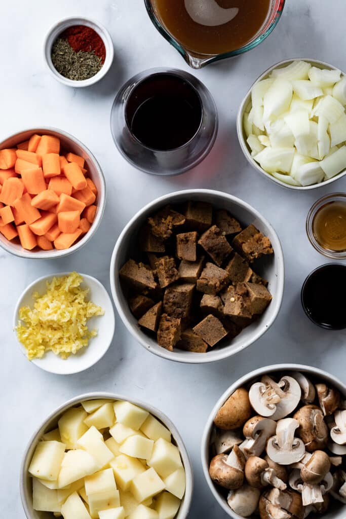 Seitan chunks and ingredients in bowls