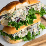 Horizontal photo of two vegan chicken salad sandwiches stacked up