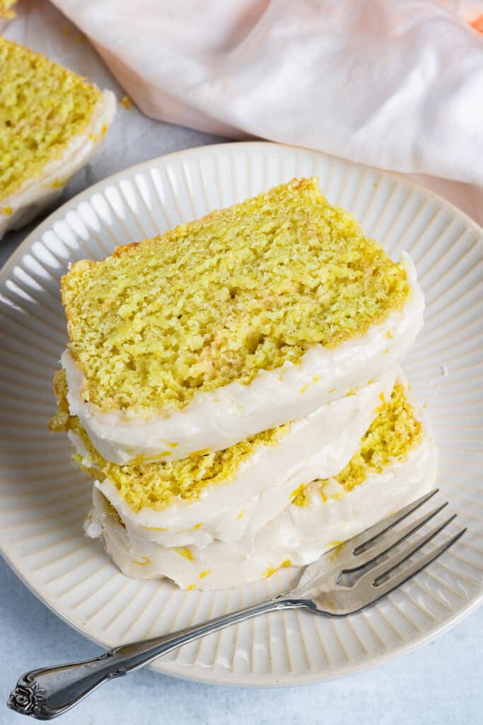Slices of Lemon Cake stacked on a plate