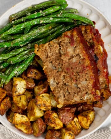 Bowl with meatloaf, potatoes and green beans
