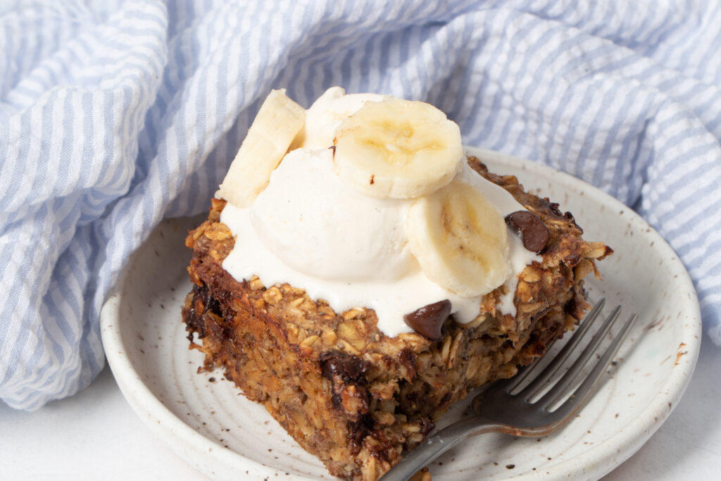 Baked chocolate chip oats topped with ice cream and bananas