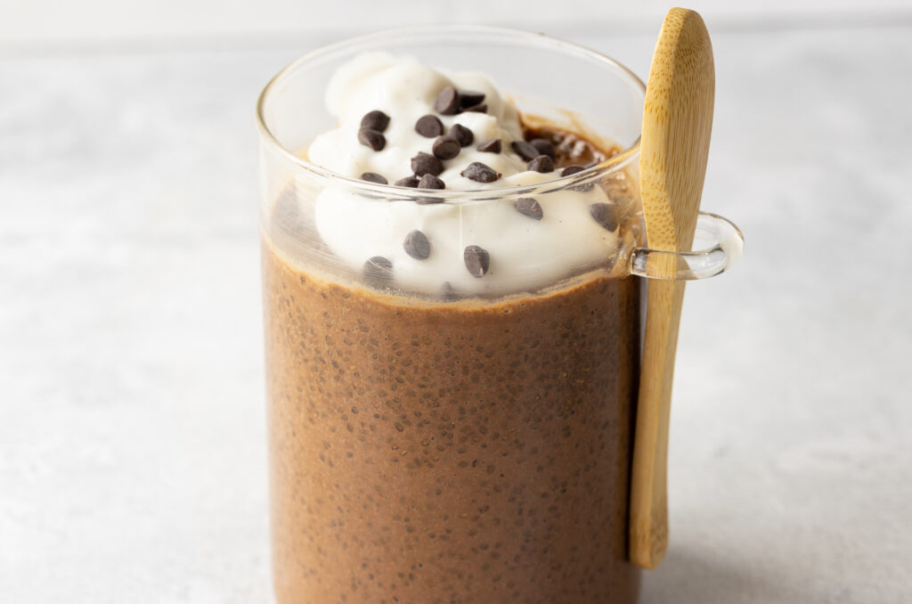 A glass jar of Chocolate Peanut Butter Chia Pudding