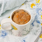 Carrot cake mug cake on a table.