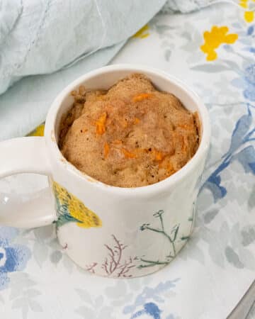 Carrot cake mug cake on a table.
